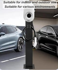 Heavy Duty Outdoor EV Charger Pedestal Built Tough For Your Ride Freestanding Charging Station with cable management, outdoors in a parking area.