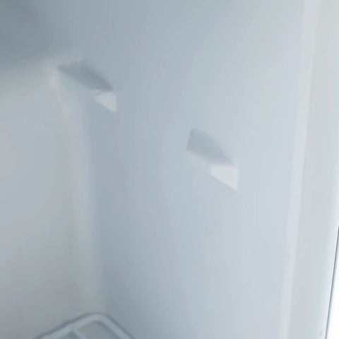 Interior view of Hella Cool 1.1 Cubic Foot Compact Upright Freezer With Slick Removable Baskets Reversible Door, showing white walls.