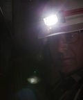 Hard Hat Headlamp With 45 Degree Tilt And Dual LED Flood And Spot Beams on hard hat in dark environment