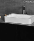 Slick Rectangular Bathroom Vessel Sink Crafted From Heavy Duty Artificial Stone Table Top Basins Featuring Thick Edges That Hold Up Over Years Durable White Countertop Washbasin on modern vanity.