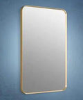Brushed Gold Rectangular Bathroom Mirror 22 X 34 Over Sink Mount against a blue wall