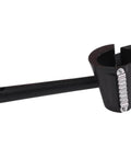 Handheld spiral vegetable slicer with black plastic housing and metal blade