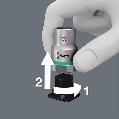 Hand using Easy Twist Unlock on Zyklop One Quarter Inch Socket Belt Set With Holding Function On A Tough Textile Belt 10 Piece Metric Socket Kit