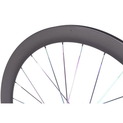 Close-up of Beefy 50mm Carbon Fiber Road Wheelset With Center Lock Disc Brakes, 24 hole design, showing rim and spokes.