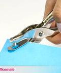 One Hole Punch For Office Use, 5 Sheet Capacity, Nickel Plated Hand Punch In Slick Silver shown punching blue paper
