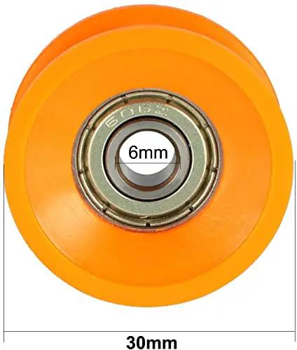 Hella Smooth V Groove Pulley Wheels With Precision Ball Bearing Rollers For Zero Headache Project Builds And Sleek Glide Action Orange Six Thirty Thirteen Millimeter Four Pack, orange pulley showing bearing and 30mm diameter.