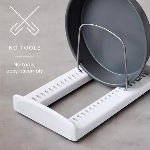 StoreMore Adjustable Bakeware Rack With Steel Wires Seven Adjustable Dividers organizing a round pan on a countertop