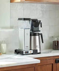 No Fuss 40 Ounce Coffee Brewer with Precise Temperature Control and a Quick 4 to 6 Minute Brew, polished silver, on kitchen counter