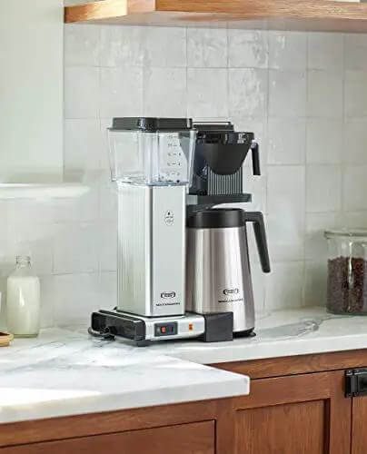 No Fuss 40 Ounce Coffee Brewer with Precise Temperature Control and a Quick 4 to 6 Minute Brew, polished silver, on kitchen counter