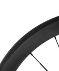 Close-up of 700C Carbon Wheelset With 45mm Deep Rim For Road Bikes, showcasing rim design and material.