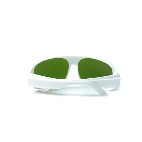 Top-Shelf Laser Protective Glasses Delivering Killer 200-1400nm Beam Blocking Coverage With 10% Light Transmission for Crystal Clear Vision During IPL Work and Heavy-Duty Photonic Optics Eyewear You Can Rely On, green lenses, white frame.