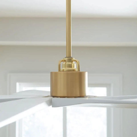 Top Tier 70 Inch 5 Blade Ceiling Fan In Matte White For Spacious Living Areas And Quiet DC Motor With Reversible Blades close-up of gold ceiling fan motor and structure.