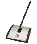 Lightweight Manual Carpet And Hard Floor Sweeper Featuring Dual Rotating Brush Roll Plus Corner Edge Brushes, compact design for easy use.