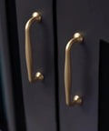 Installed Six Pack 5 Inch Center To Center Modern Champagne Bronze Cabinet Pulls on dark cabinet doors