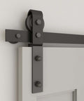 Close-up view of 43 Inch Bi Folding Sliding Barn Door Hardware Kit with side mounted bifold system and two rollers.