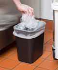 Rectangular black plastic wastebasket, 13 qt (3.25 gal) with a clear bag liner, Sam.