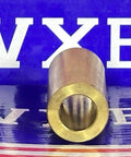 Front view of 3/8" x 5/8" x 1-1/2" inch Bearing - Bronze Bushing Plain Sleeve on reflective surface.