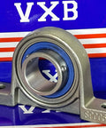 25mm Bore Miniature Stainless Steel Pillow Block Mounted Bearing on a blue and red background.