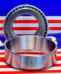 32005X Tapered Roller Bearing 25x47x15mm, cone and cup in chrome steel, shown on striped background, designed for heavy radial loads
