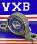 10mm Bore Miniature Stainless Steel Pillow Block Mounted Bearing on display with blue seal and compact mount design.