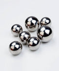 5.556mm Steel Balls Solid Carbon Steel Balls 50pcs Hunting Ball Bearing Ball clustered on white surface