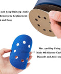 Hand holding blue sanding block with 5 Inch Hook And Loop Sanding Discs Set 50 Pcs For Wet Dry Polishing, showcasing silicon carbide material.