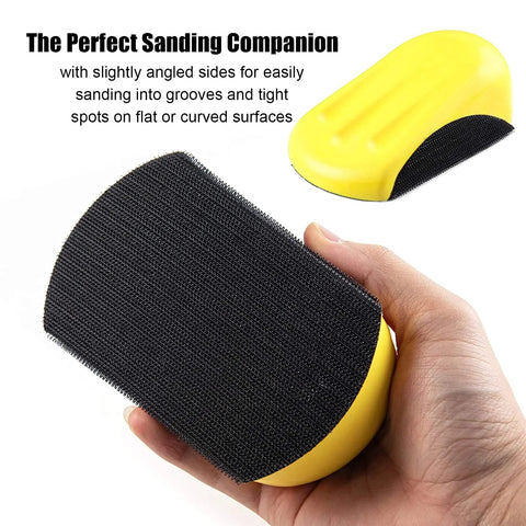Close-up of a hand holding a yellow 5 Inch Hook And Loop Mouse Sanding Block, showing the hook-and-loop pad for woodworking and furniture.
