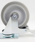 Side view of Pack Of 4 5 Inch Swivel Caster Wheels With Dual Locking Brakes In Gray TPR Rubber, metal housing, top plate mounted.