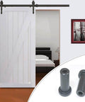Close-up of 5 Pack 2 Inch Barn Door Spacers for Sliding Barn Door Hardware, solid cast iron with black powder finish, installed view.