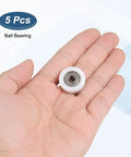 Hand holding 5x22x7 mm ball bearing; focuses on Five Pack 5x22x7 Mm 625ZZ Ball Bearing Guide Nylon Roller Bearings With Double Metal Shield.