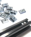 50 Pcs M5 Sliding T Nuts for 2020 Aluminum Extrusion with 6mm Slot Metric M5 T Slot Nuts on black extrusion profile