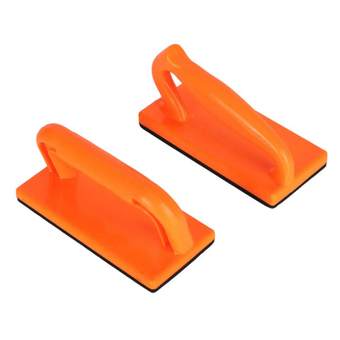 Two orange blocks from Five Piece Pro Grade Push Block Set For Woodworking With ABS Construction And Smooth Ergonomic Handles