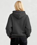 Back view of woman wearing Sexy And I Tow It Vintage Funny Camping RV Camper Truck Hoodie For Women Cozy Fleece Sweatshirt