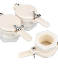 Group of three white plastic honey gate valves with lever taps for 5-gallon honey buckets.