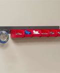 Heavy Duty Wall Mount Garage Storage Steel Louvered Rail System For AkroBins, Wall Bin Organizer, grey rail with red bins filled with tools.