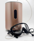 Hydrogen generator with Eye Mask Goggles for Hydrogen Gas Inhalation and Eye Fatigue Relief, shown over glasses with tubing connection.