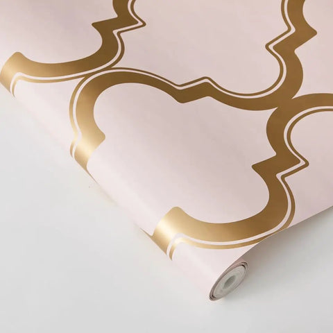 Pink and Metallic Gold Marrakesh Peel and Stick Wallpaper with Moroccan Trellis Design on Matte Backdrop, roll view.