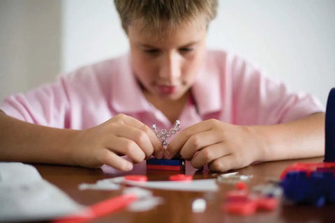 Child using Magnet Science Kit for Kids With 10 Hands On Magnetic Experiments And Games And 25 Plus Pieces To Build And Learn STEM