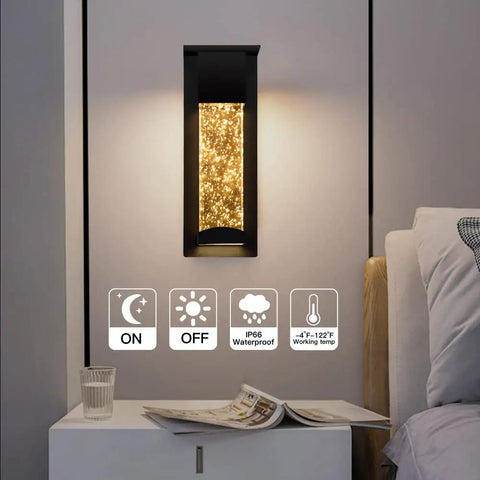 2 Pack Crystal LED Wall Lights With Frosted Matte Shade illuminated beside bed, sleek black aluminum sconce for indoor use, warm glow.
