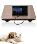 Heavy Duty Digital Shipping Scale With Six Hundred Sixty Pound Load And Smooth Stainless Steel Platform For Real Deal Accurate Parcel Weighing Plus Straight Up LCD Readouts on a flat surface with a puppy and kitten.