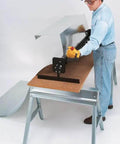 Worker using Portable Mini Metal Brake 48 Inch 22 Gauge Capacity Bends Up To 135 Degrees for bending roof flashing on job site