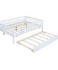 Full-Size Wood Daybed With Trundle And Fence Guardrails In White Finish showing trundle and sturdy frame