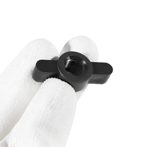Six Pack MKP 10 Prop And Nut Kit B component, black metal nut, for half inch prop shafts, shown in a gloved hand