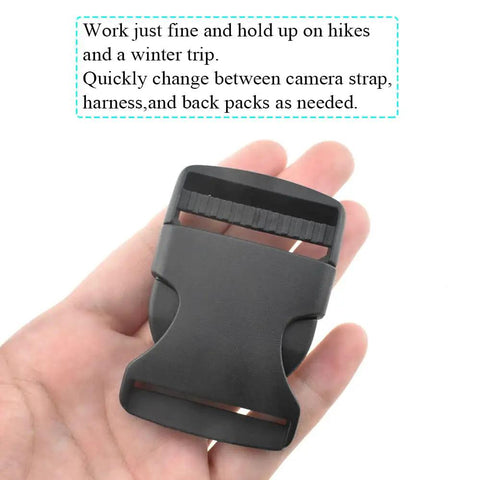 Hand holding 1.5 Inch Quick Side Release Buckles 4 Pack No Fuss Durable Plastic Clips For Nylon Webbing Straps Great For Backpacks Dog Collars Belts And Gear Easy Quick Release Withstand Constant Motion Secure Hold.
