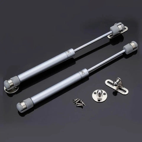Heavy Duty Gas Hydraulic Struts Pair Delivering Smooth Soft Close Assist For Sturdy Flip Doors And Large Toy Box Lids with installation hardware.