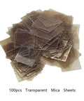 Pile of transparent mica sheets, pack of 100, showcasing thin, lightweight thermal conductor sheets for high temperature insulation.