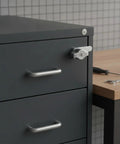 Sturdy Cam Lock For Cabinets, File Drawers And Cupboards, showing zinc alloy lock with silver finish on gray metal drawer.