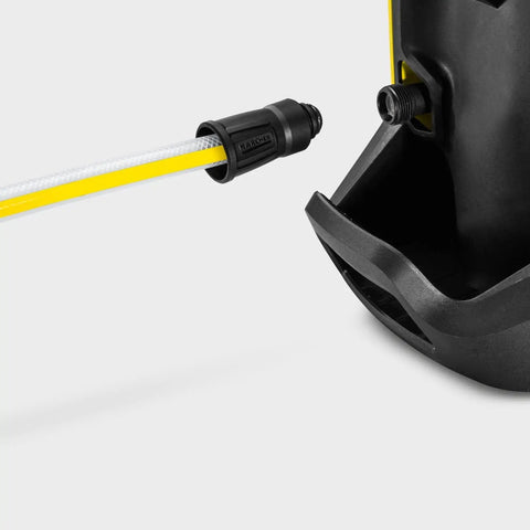 Close-up of water suction hose connecting to electric pressure washer, showing easy fit design with debris filter attachment.