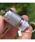 12V DC Full Metal Planetary Gearbox Reducer For Stepper Motors Heavy Duty Gear Reduction Unit in hand, showing wiring connectors