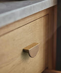 Antique Brass Zinc Alloy Cabinet Pulls 2.5 Inch Hole Center 64mm Striped Decorative Handles on wooden drawer in kitchen